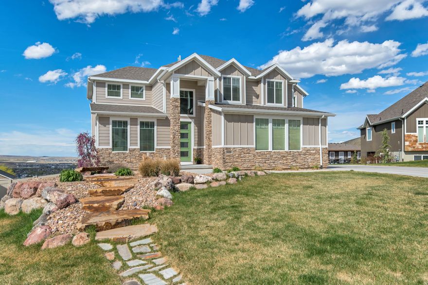 Nestled in the desirable foothills of Herriman, this beautifully designed 5-bedroom, 4.5-bathroom home offers the perfect blend of space, comfort, and scenic surroundings. The bright, open-concept floor plan is filled with natural light, creating an inviting atmosphere ideal for both everyday living and entertaining.  The spacious layout features well-appointed living areas, a thoughtfully designed kitchen, and generous bedrooms, including a luxurious primary suite. A fully finished walk-out basement provides additional living space with easy access to the outdoors-perfect for gatherings, recreation, or multi-generational living.  Situated on a meticulously landscaped 0.33-acre lot, the property offers ample room to relax, play, and enjoy the peaceful foothill setting. With its combination of modern design, functional layout, and prime location, this home is a standout opportunity in one of Herriman's most sought-after areas.