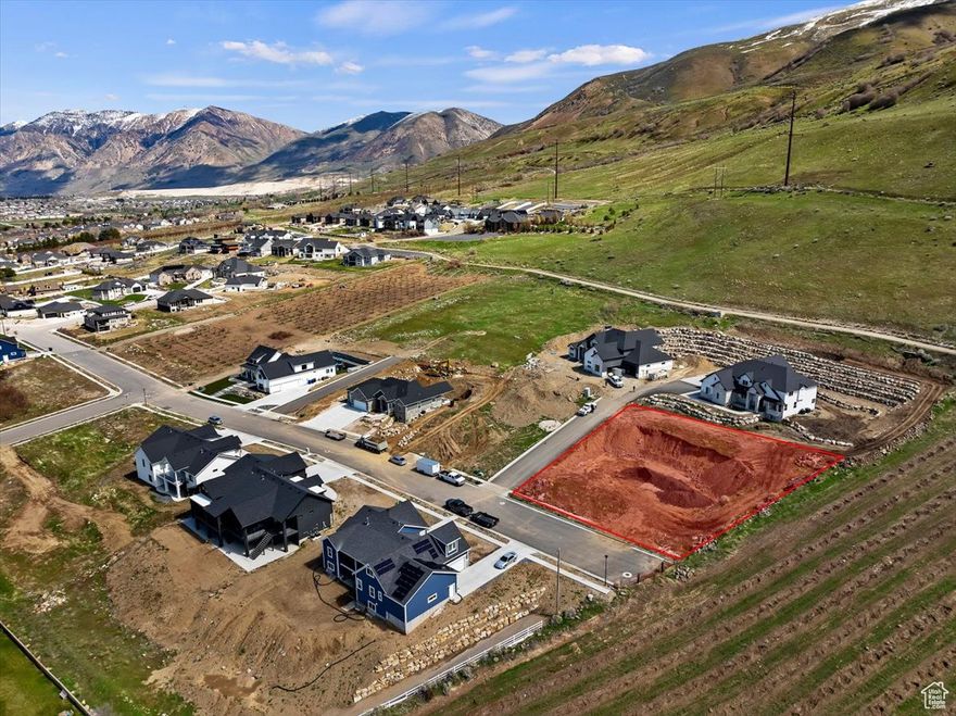 Build your dream home on this stunning lot with breathtaking panoramic views of Willard Bay! Enjoy the perfect blend of privacy and convenience - just minutes to Brigham City and only 25 minutes to Ogden. This lot sits right below BLM land, with direct access to miles of scenic trails right from your backyard. All utilities are already stubbed, including secondary water, and there's no HOA to worry about! The owner chose this special property for its unbeatable location at the end of a quiet dead-end street, bordered by open space and beautiful orchards.