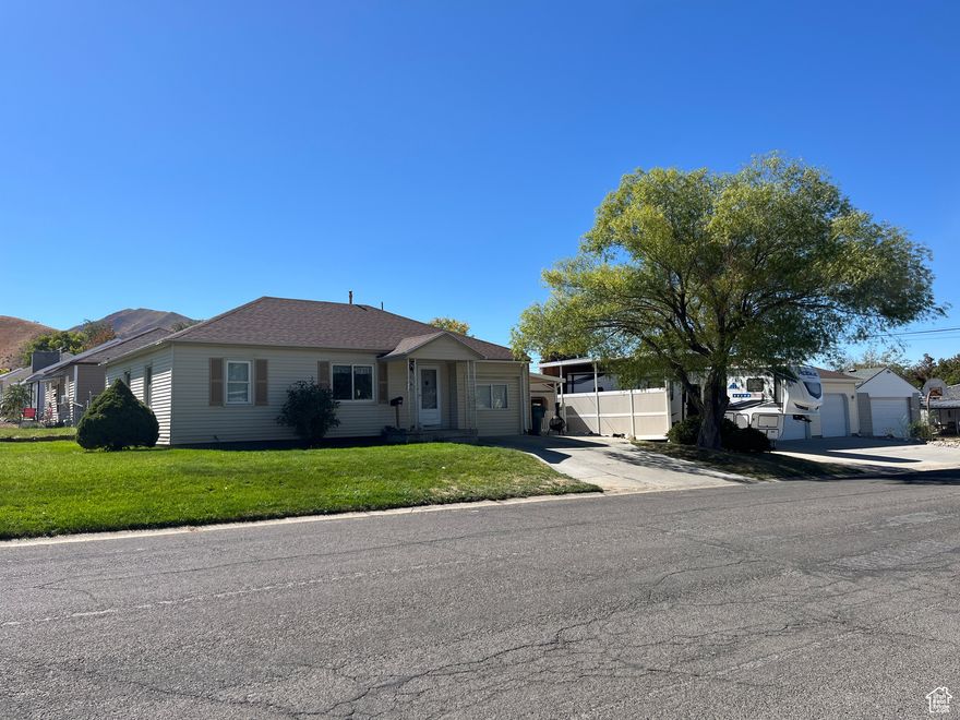 Welcome to this cozy and affordable 3-bedroom, 1-bath home perfect for first-time buyers, downsizers, or investors! This property offers tons of potential with a functional layout and just the right amount of space inside and out. Oversized 3-car garage ideal for storage, hobbies, or a workshop. Large covered RV parking to protect your toys from the elements. A little TLC will bring this home back to life. Tenant-Occupied - Renters currently in place will be vacating, making this property available for immediate move-in or renovation.   Square footage figures are provided as a courtesy estimate only and were obtained from Tooele County. Buyer is advised to obtain an independent measurement.