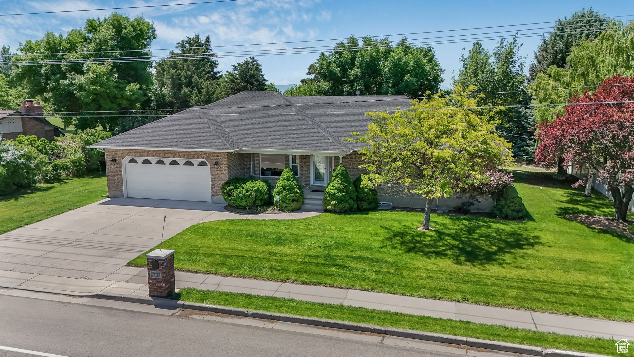 Beautifully maintained 6-bedroom, 4-bath rambler in a sought-after Highland neighborhood, backing directly to Alpine Country Club. Enjoy panoramic golf course views from your covered deck and stunning mountain views to the north and east. Open-concept layout with vaulted ceilings, a large great room, and main-floor laundry. The fully finished basement includes a large second living area, a theater/flex room, and is plumbed for a second kitchen-perfect for multigenerational living or future rental options. Despite being near a main road, the interior is peaceful and quiet, thanks to excellent insulation. Street design also allows for easy backing out and extra space for parking. Mature landscaping, private yard, and walking distance to schools, trails, and just minutes from Traverse Mountain and I-15. Square footage is a courtesy estimate from county records. Buyer to verify all.