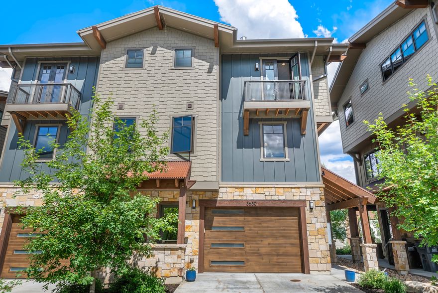 Must-see Park City townhome where elevated mountain living and year-round adventure come together in spectacular fashion. Located on Lower Village Road and bordering the 13th fairway of the Canyons Golf Course, Blackstone Residences offers an exceptional lifestyle in one of Park City's most desirable locations. Just a short walk from the Cabriolet lift or enjoy the convenience of shuttle service pickup directly from your door, providing effortless access to world-class skiing and recreation. This stunning 3-bedroom, 3-bath end-unit residence is filled with natural light and thoughtfully designed for both comfort and entertaining. The open floor plan features Viking stainless steel appliances, upgraded countertops, modern tile and natural stone finishes, tile flooring throughout the main level, upgraded canned lighting throughout the home, Grohe kitchen and bathroom fixtures, full-size LG washer and dryer, Lutron and Restoration Hardware lighting, air conditioning, Pella windows, and Trex decking. Sliding screen doors allow you to leave the doors open and enjoy the cool mountain air during summer evenings. Cozy upgraded fireplaces create the perfect retreat after a day on the slopes, while the deck off the dining area and private balcony provide inviting outdoor living spaces. The heated oversized two-car garage offers additional storage, and your private hot tub just outside the back door creates the perfect place to relax year-round. This home has been exceptionally well maintained and has never been used as an Airbnb. Blackstone residents enjoy outstanding on-site amenities including a clubhouse, pool, hot tub, fitness center, and fire ring. Ideally located near skiing, golf, hiking, biking, dining, shopping, and entertainment, this property offers the perfect balance of convenience, recreation, and mountain living. Nightly and short-term rentals are approved, making this an incredible opportunity for a primary residence, mountain getaway, or exceptional investment property in the heart of Canyons Village. Square footage figures are provided as a courtesy estimate only and were obtained from appraisal.  Buyer is advised to obtain an independent measurement.