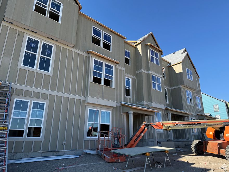 THIS UNIT IS UNDER CONSTRUCTION. THESE PHOTOS ARE OF ANOTHER UNIT OF THE SAME FLOOR PLAN. OPTIONS AND FINISHES MAY VARY. Step into this stunning townhome nestled in the heart of Daybreak, one of Utah's most active and beautiful master-planned communities. Just steps from multiple parks, green spaces, and scenic walking trails, this home offers the perfect blend of outdoor living and modern convenience. Enjoy a bright, open floor plan with large windows that flood the space with natural light, a stylish kitchen with upgraded finishes, and comfortable bedrooms designed for both rest and flexibility. Whether you're relaxing on your private patio or exploring the nearby lakes, playgrounds, and community events, this home keeps you connected to the best of Daybreak living.