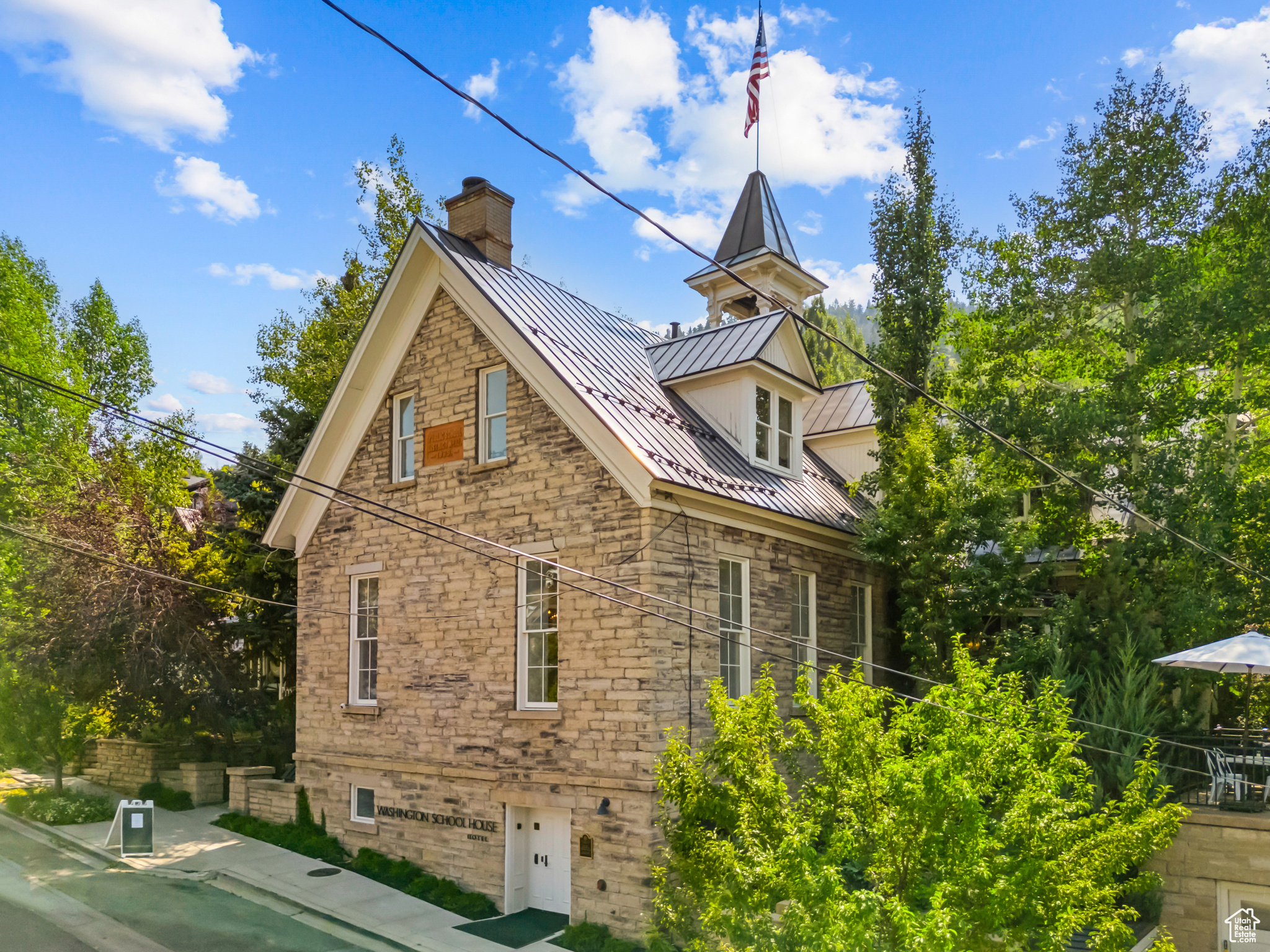 Welcome to The Washington School House, an extraordinary landmark nestled in the heart of Park City, where history seamlessly merges with contemporary luxury to offer a unique opportunity as both a prestigious hotel or an exquisite single-family residence.  A Legacy of Distinction - Immerse yourself in the storied past of Park City at The Washington School House-a cherished icon originally constructed in 1889,as one of the original schoolhouses in Park City. Later transformed into a vibrant dance hall that was operational into the 50's. And then in 1984, meticulously reimagined into a quaint bed and breakfast. Today, this historic, completely renovated gem stands as an unparalleled world-renowned boutique hotel, exuding a sense of exclusivity and refinement. Elegance Redefined - Step into a world of refined elegance where historical charm meets modern sophistication. The Washington School House radiates allure, reminiscent of Parisian chic amidst the majestic backdrop of Park City's scenic vistas. While it was the first of 3 original Park City schools, it is the only one standing today. This distinguished property sets the stage for a truly presidential and even revolutionary experience, defining a new pinnacle in luxury hospitality. Indulgent Accommodations - Discover twelve meticulously appointed rooms, each a sanctuary of comfort and style. Adorned with antique furnishings, original artworks, and bespoke amenities, every detail within The Washington School House is intentional and invites you to embark on a sensory journey unlike any other. The Grandeur of Gathering - At the heart of this magnificent estate lies the grand living room, featuring a monumental white fireplace crowned by an antique gold-framed mirror rescued from a French opera house and painstakingly restored specifically for this purpose. Perfect for aprs and intimate gatherings, this inviting space offers a cozy retreat after a day of adventure on Park City's renowned slopes. Lavish Outdoor Retreat - Step outside into an incredibly quiet mountain sanctuary, where an inviting swimming pool and rejuvenating hot tub await-a tranquil haven for relaxation and rejuvenation. Prime Location, Timeless Appeal - Ideally situated on Park Avenue, mere steps from the vibrant Main Street of Old Town, The Washington School House offers a peaceful escape amidst the historic allure of Park City's mining heritage. Though not technically ski-in/ski-out a very quick 150 steps grants you, easy access to the famed Quittin' Time trail ensures effortless exploration of the exhilarating slopes nearby. An Unrivaled Investment Opportunity - Available now for discerning investors at $28,000,000.00, this iconic property presents a once-in-a-lifetime chance to acquire a piece of Park City's illustrious legacy. Whether as an esteemed boutique hotel or a magnificent private residence, embrace the opportunity to own a place where history and luxury converge in perfect harmony-a testament to timeless elegance and exceptional living.