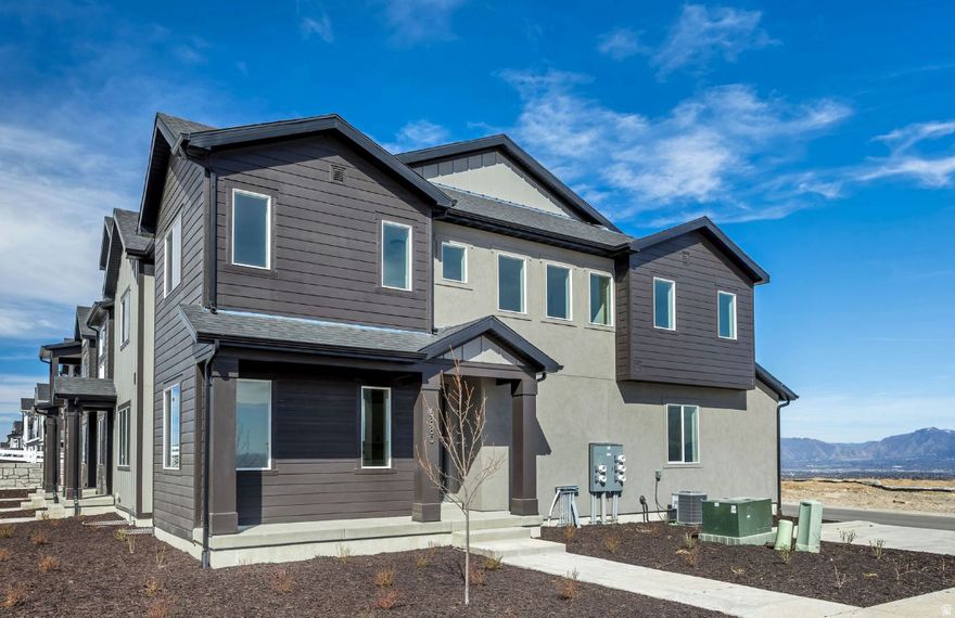 This cozy Buchanan floorplan has 2-bedroom ensuites located on the second floor, one being the primary suite, and the other being a large secondary bedroom, both of which have their own walk-in closet, and full bathroom attached. This home is an end unit, which captures a healthy amount of natural lighting. It's located near the community pool, and has access to parking nearby, perfect for any guests that may come to visit. This floorplan has an unfinished basement, which is pre-plumbed for a future bathroom, and it has space for a future bedroom as well. It comes with a 2-car garage, a half bathroom on the main floor, one section of black metal railing, a gas range stove, and two sinks in the primary bathroom. Come check out this popular floorplan for such an affordable price!