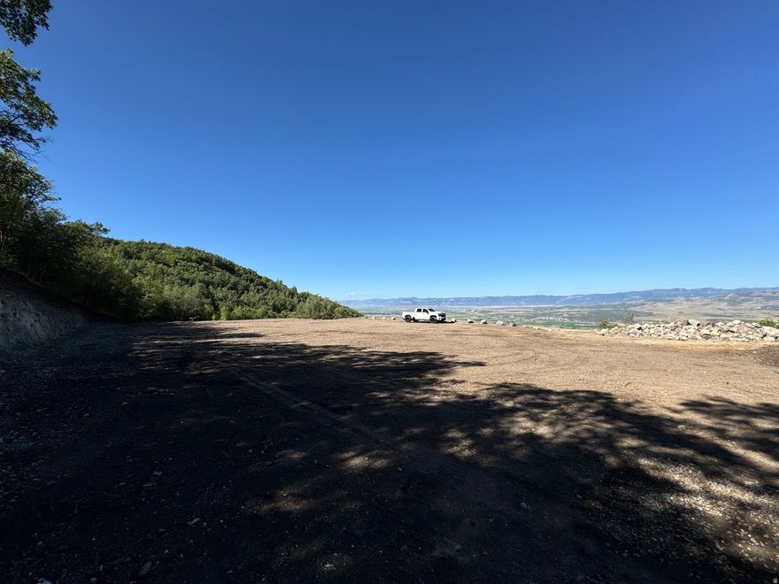 Imagine waking up to sweeping panoramic views of the mountains and valley below - every single morning, from the cabin you've always dreamed of building. This rare 2.5-acre lot in The Hollows community at Skyline Mountain Resort in Fairview, Utah is not just a piece of land. It's your launchpad to the mountain lifestyle. Just 90 minutes from Salt Lake City, this is the kind of escape that most people dream about and few actually find. Located along the legendary Skyline Drive, you'll have direct access to world-class ATV trails and snowmobiling routes right out your front door. When the seasons change, so does the adventure - world-renowned fishing and hunting, plus a short drive to the Palisade Golf Course, make every season worth staying for. The hard work is already done. This lot has been excavated, graded, and thoughtfully prepared so you can focus on building, not clearing. Power and water are at the road and ready for hook-up, the driveway is in with compacted road base, a 12" culvert is installed, and a new 20' Conex container - mostly buried and fully structurally supported - is already on site and ready to serve as built-in storage or the start of something creative. In a cabin community where lots like this rarely come available, Lot 12 stands out. The prep work alone represents significant investment, and the views are simply irreplaceable. Information to be verified by buyer. Driving Directions 39.60499,-111.38738