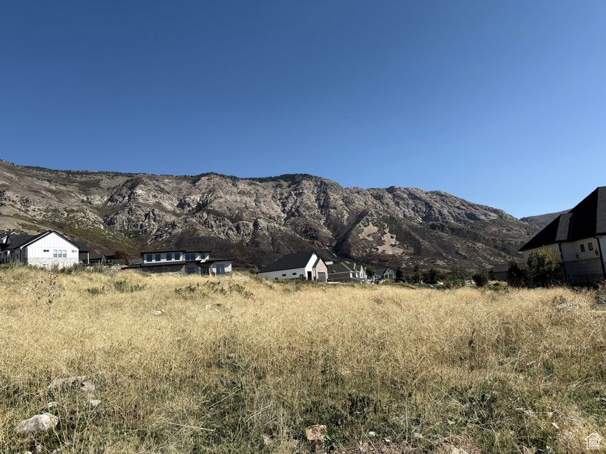Perched high on the desirable North Ogden Bench, this exceptional .57-acre lot offers panoramic views of the majestic mountains and sweeping valley below. Build your dream home in one of the most scenic and sought-after locations in the area. Enjoy stunning sunrises, serene sunsets, and a peaceful atmosphere-all while being just minutes from hiking trails, parks, and local amenities. This lot is ideal for a custom home designed to take full advantage of the natural beauty surrounding it. Don't miss this rare opportunity to own a premium view lot in North Ogden!