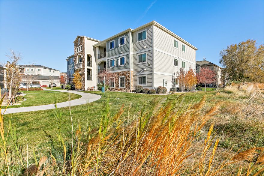 * OPEN HOUSE SAT. 12/6 12 PM to 1 PM! * Enjoy panoramic valley views and vibrant sunsets from this beautifully maintained main floor condo with 1 car garage! The thoughtful floor plan features a spacious open-concept living with 9 ft ceiling and dining area with a primary suite situated separately from the additional bedrooms for added privacy. An entrance to the Jordan River Trail is conveniently located just down the street, offering easy access to outdoor recreation.  Numerous upgrades make this home a steal, including a built-in humidifier, Nest thermostat, recessed LED lighting, quartz countertops, a pop-up workbench, and bonus shelving in both the outdoor storage closet and garage. A ladder bookcase, entertainment center, and 65-inch TV are included with the sale.  Residents of this community enjoy a friendly neighborhood atmosphere with multiple nearby parks, playgrounds, walking paths, and a dirt bike park. The community pool and clubhouse gym offer excellent amenities, and internet service is included in the HOA fee, with the option to upgrade to 1-gig service for just $20 per month.