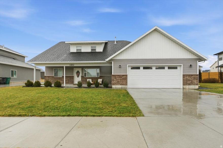 Located on the desirable north end of Logan, this beautifully maintained home offers modern comfort, thoughtful design, and plenty of space both inside and out. Built in 2019, the home features 5 bedrooms and 3 bathrooms with a spacious and functional layout. The heart of the home is the stunning modern kitchen, showcasing granite countertops, custom cabinetry, and vaulted ceilings that create an open and inviting atmosphere. The main floor includes a comfortable living area, perfect for relaxing or entertaining. The main-floor primary suite offers convenience and privacy with its ensuite bathroom and walk-in closet. Step outside to enjoy the covered back patio, ideal for outdoor dining or quiet evenings. The property sits on a generous .35-acre fully fenced, landscaped lot complete with garden beds and a storage shed, offering plenty of room to garden, play, or simply enjoy the space. This well-cared-for home combines modern finishes, a spacious layout, and a fantastic location.