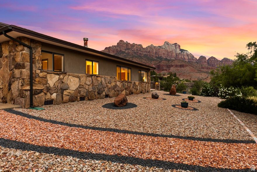 Set on over 2 acres of prime Springdale terrain, just moments from the gates of Zion National Park, this rare estate offers more than just proximity to natural wonders-it offers a canvas for your legacy. With commanding canyon views, a reimagined ADU, and a massive 48' x 30' (1,440 sq ft) detached RV garage/shop, this property is a standout in both setting and scope. The main residence spans 1,217 sq ft, with 2 bedrooms and 2 bathrooms, thoughtfully oriented to maximize natural light and one-of-a-kind views. A spacious great room invites the outdoors in through oversized picture windows, while warm wood finishes and natural textures ground the space in timeless desert style. The layout is livable now-but equally ready for a visionary transformation. Tucked just beyond a breezeway, the fully remodeled guest unit (ADU) provides turnkey space for guests or long-term income, with privacy and flexibility built in. The 1,440 sq ft RV garage/shop is a rare find in Springdale-ideal for adventurers, collectors, or anyone needing extra room to store, build, or create. With a location that's quite literally at the edge of Zion, the current owner notes she's going to miss the menagerie of birds, quail, chipmunks, and deer that call this yard theirs. This is more than a home-it's a foothold in one of the most iconic landscapes in the West. Move in as-is or bring your architect and reimagine it all.