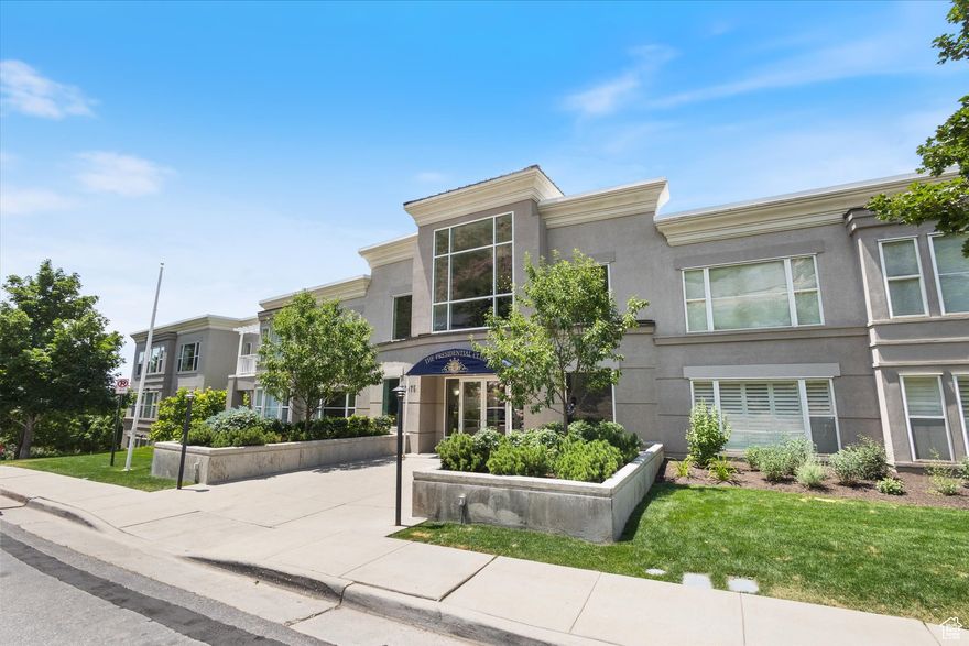 Discover elegant comfort in this beautifully updated condo at the prestigious Presidential Club. This spacious home features two generous bedrooms and a versatile office nook - perfect for remote work or creative pursuits. The open-concept design is enhanced by rich, hand-scraped hardwood floors, sleek quartz countertops, custom cabinetry, and premium stainless steel appliances. Sunlight pours in through expansive windows, creating a bright and serene living space.  Residents of the Presidential Club enjoy an impressive suite of amenities, including a stylish lounge with a full kitchen, a private theater with tiered seating, a library, game room, clubhouse, and a fully equipped fitness center. Outside, unwind in the beautifully landscaped courtyard with a fountain, fire pit, BBQ area, and inviting green spaces - ideal for gatherings or quiet moments.  This unit includes deeded parking in a secure, climate-controlled garage along with a private storage room for added convenience.