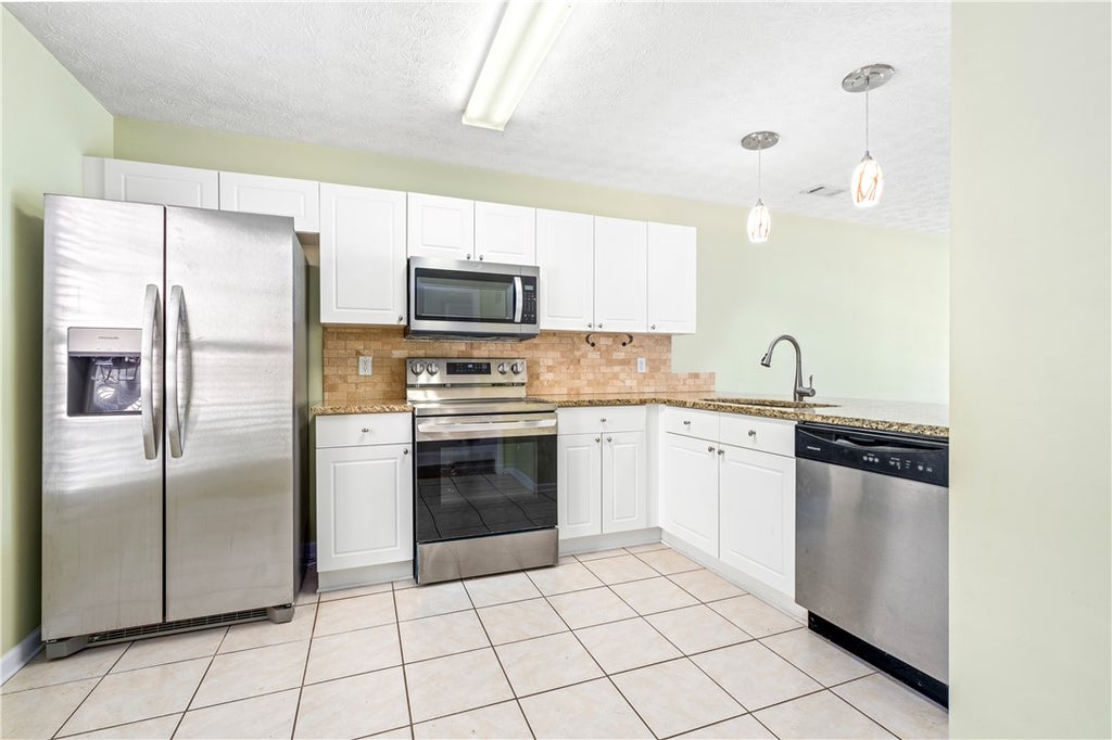 Photo of 1477 N DONAHUE Drive #504, Auburn, AL 36830 (MLS # 182208)