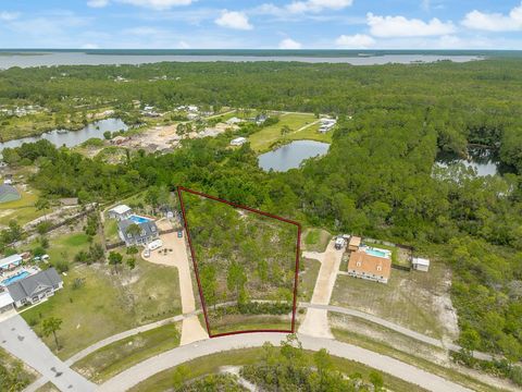 Photo of 355 Lily Cir, Eastpoint, FL 32328 (MLS # 324225)
