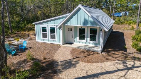 Photo of 121 Cedar St, Eastpoint, FL 32328 (MLS # 327696)