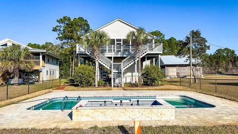 Photo of 387 River Rd, Carrabelle, FL 32322 (MLS # 324877)