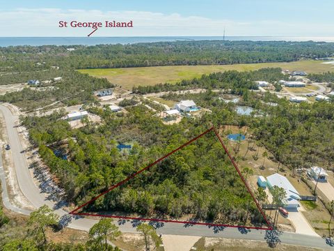 Photo of 216 Ridgecrest Pkwy, Eastpoint, FL 32328 (MLS # 321114)