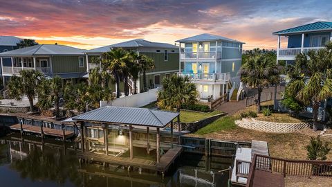 Photo of 111 N 32nd St, Mexico Beach, FL 32456 (MLS # 328193)