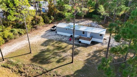 Photo of 276 Twin Lakes Rd, Eastpoint, FL 32328 (MLS # 324651)