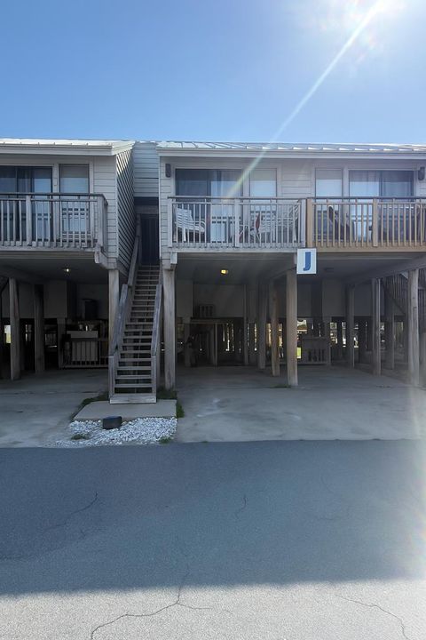 Photo of 1804 E Gulf Beach Dr #J 3, Saint George Island, FL 32328 (MLS # 321046)