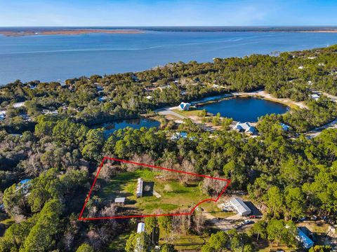 Photo of 135 Daisey St, Eastpoint, FL 32328 (MLS # 322324)