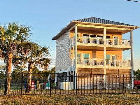 Photo of 501 W Gulf Beach Dr, Saint George Island, FL 32328 (MLS # 327677)