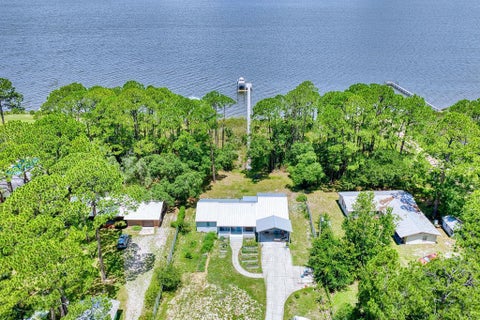 Photo of 191 N Bay Shore Dr, Eastpoint, FL 32328 (MLS # 328953)