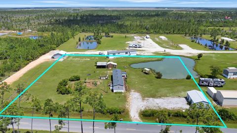 Photo of 385 Sunshine Rd, Port Saint Joe, FL 32456 (MLS # 321806)