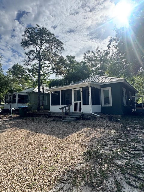 Photo of 102/104 SE 1st St, Carrabelle, FL 32322 (MLS # 328724)