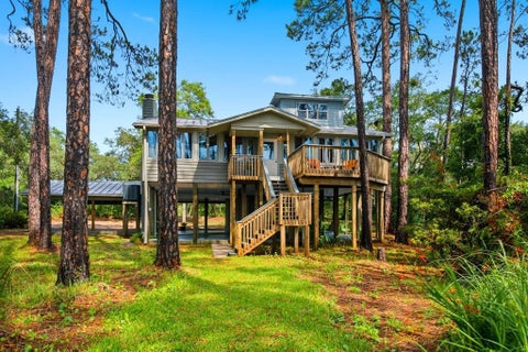 Photo of 203 N Bay Shore Dr, Eastpoint, FL 32328 (MLS # 328853)