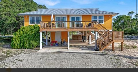 Photo of 1041 W Gulf Beach Dr, Saint George Island, FL 32328 (MLS # 324105)