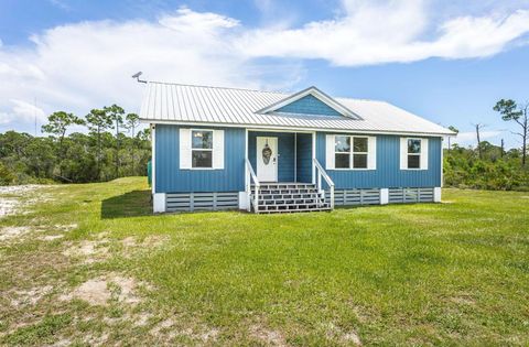 Photo of 300 Blue Heron Dr, Eastpoint, FL 32328 (MLS # 324208)