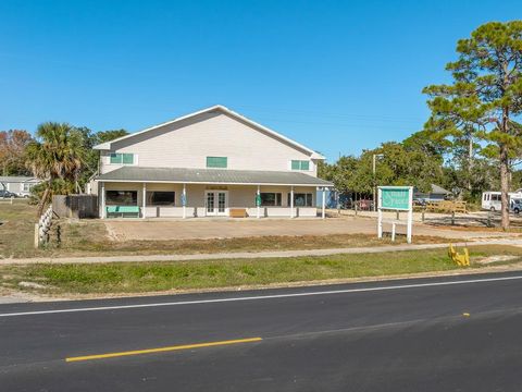 Photo of 203 Hwy 98, Eastpoint, FL 32328 (MLS # 324593)