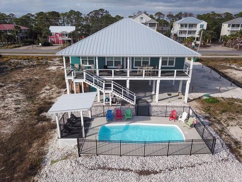 Photo of 1056 E Gulf Beach Dr, Saint George Island, FL 32328 (MLS # 316117)