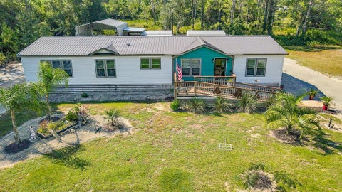 Photo of 511 NE Ave H, Carrabelle, FL 32322 (MLS # 329510)