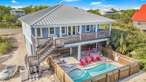 Photo of 1024 W Gulf Beach Dr, Saint George Island, FL 32328 (MLS # 324256)