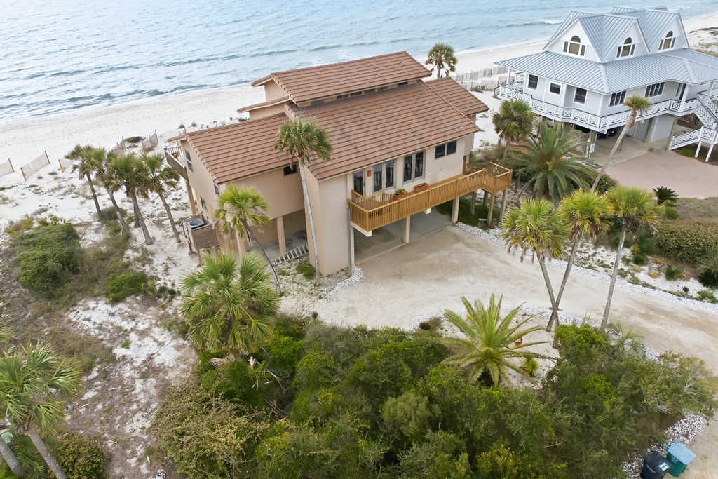 Located within a highly desirable gated coastal community, this never- – image 4