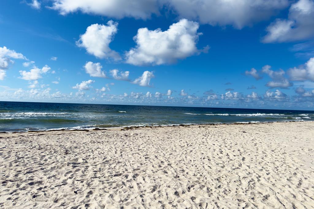 Located within a highly desirable gated coastal community, this never- – image 55