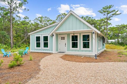 Photo of 121 Cedar St, Eastpoint, FL 32328 (MLS # 323763)