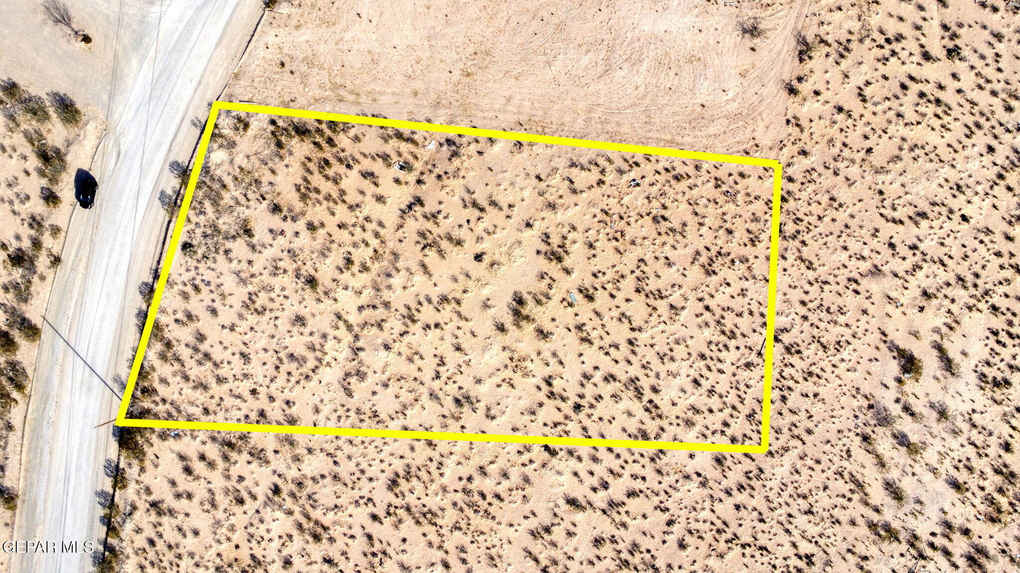 Above view of land by paved road