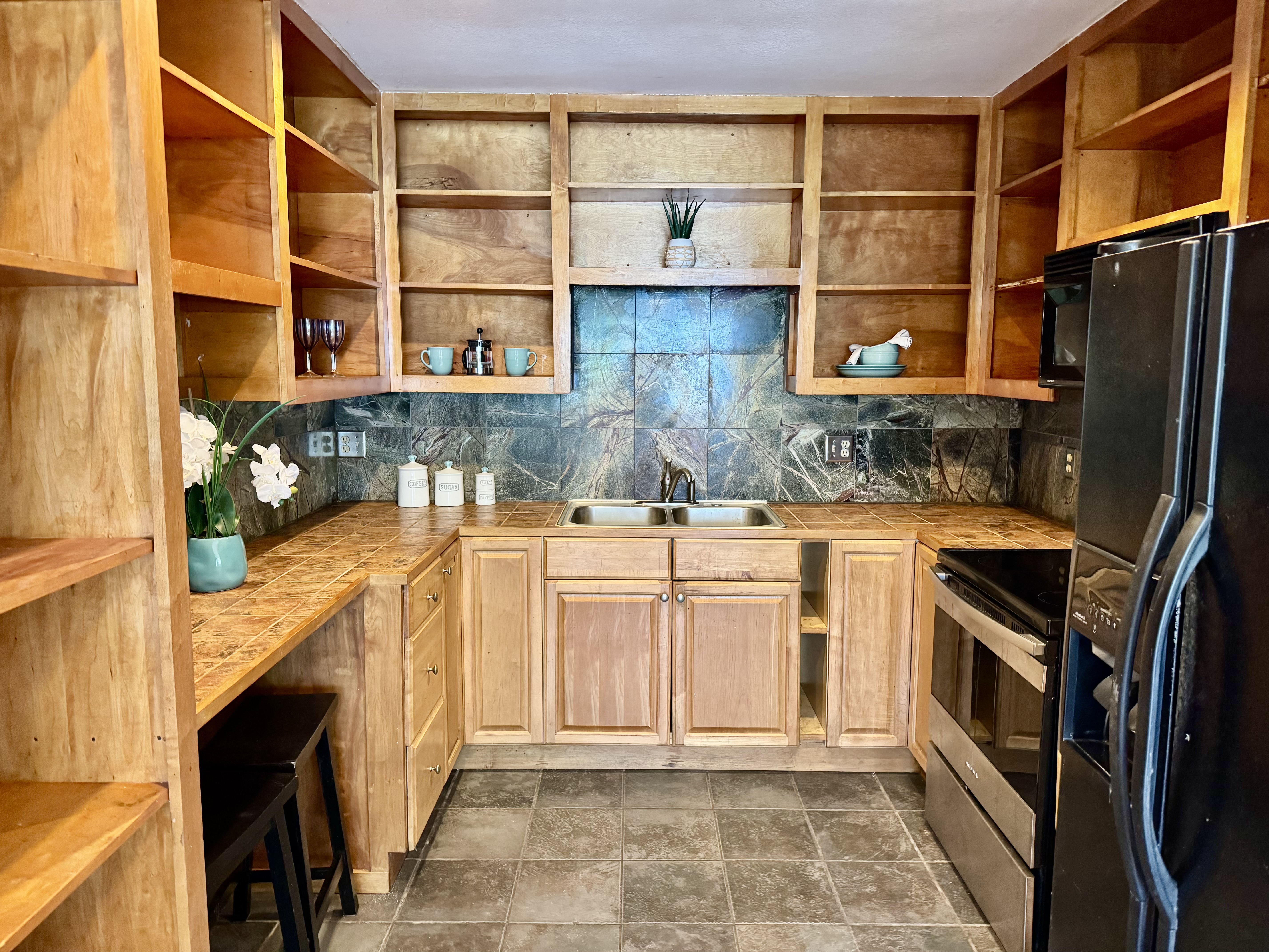 Beautiful custom cabinets with a marble backsplash in this updated home!!