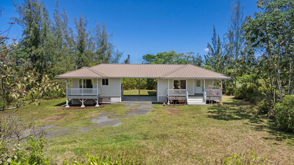 4 bedroom 3 bath house located at 15-1889 3rd Ave, Keaau, HI 96749.
