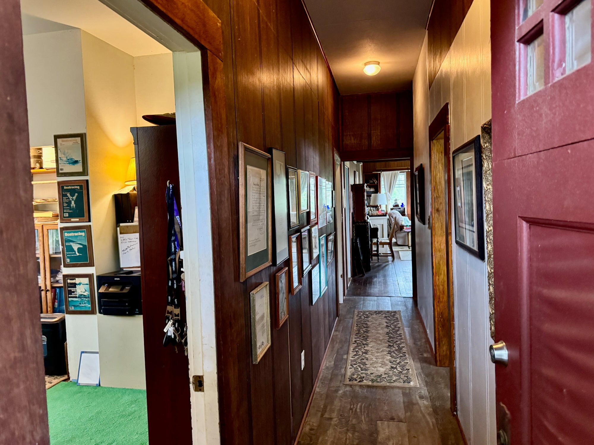 Entry way leading to three bedrooms and bath on left, kitchen and laundry on right, living and dining room straight ahead