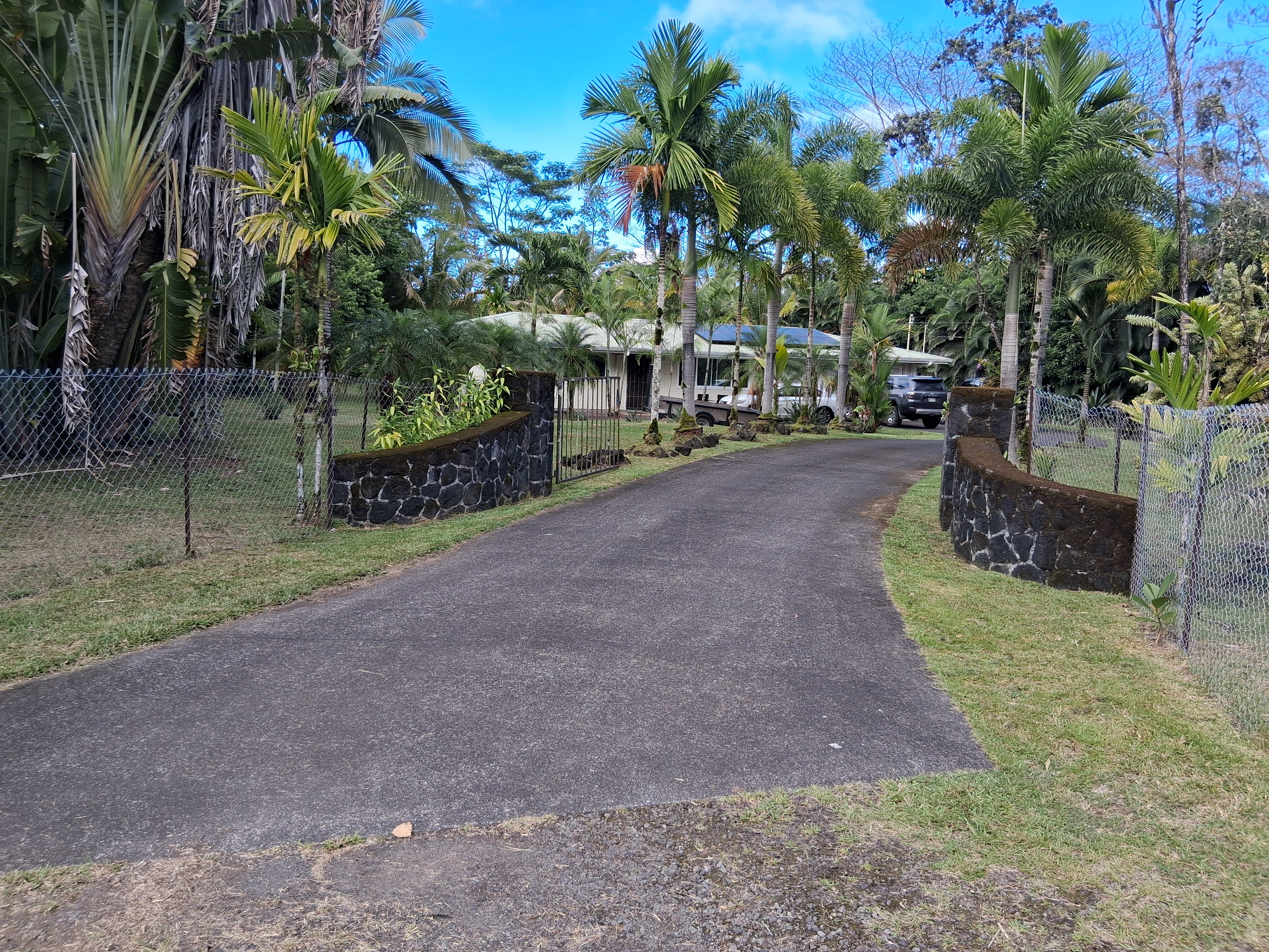 Entry, gate and paved driveway