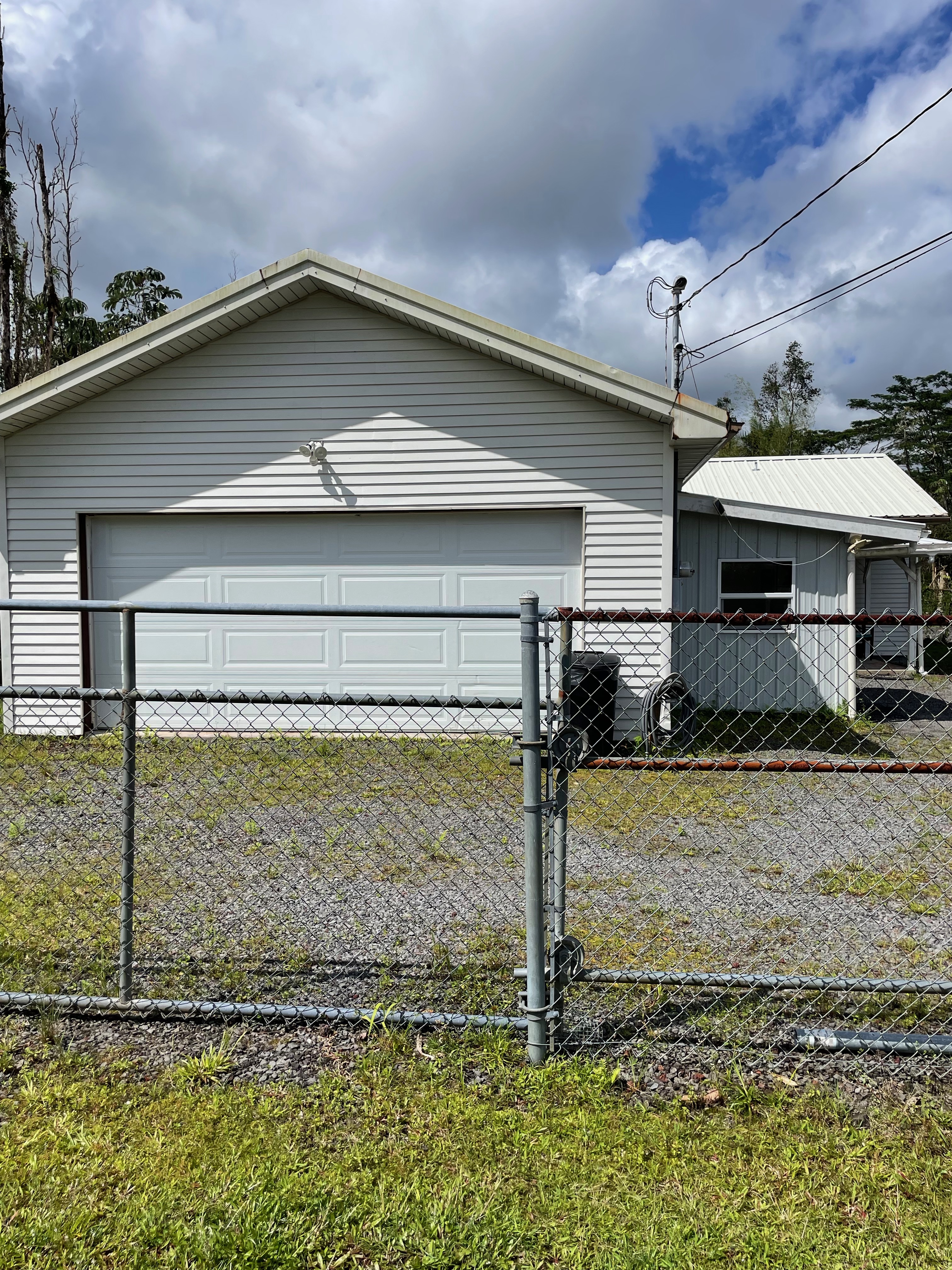 Large detached garage with fully fenced property.