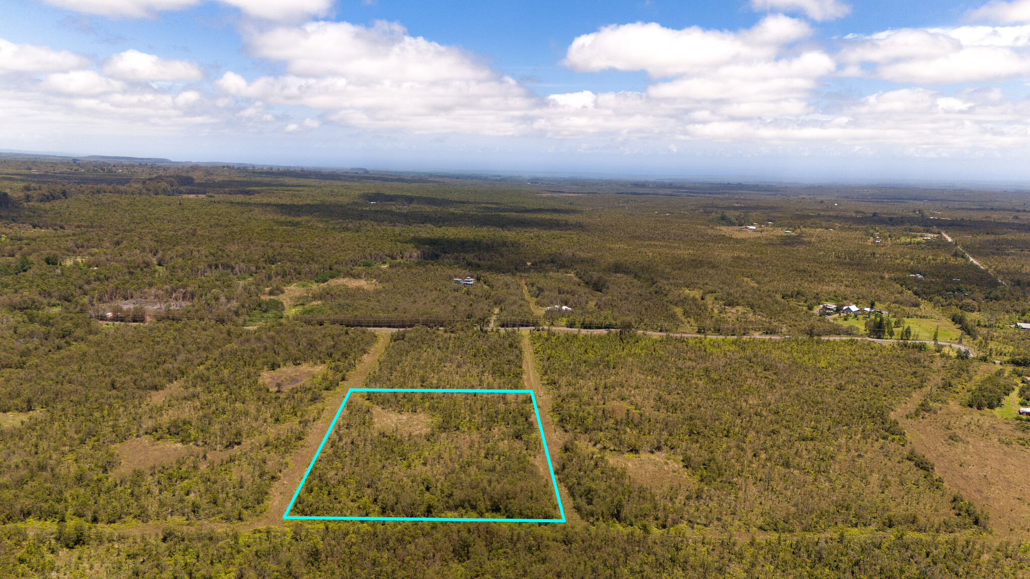 Looking makai. Property is almost square. House site is partially prepped. Interior roads are in good condition. Ready for power to come from Glenwood Road. Nature trails span the length of the subdivision.