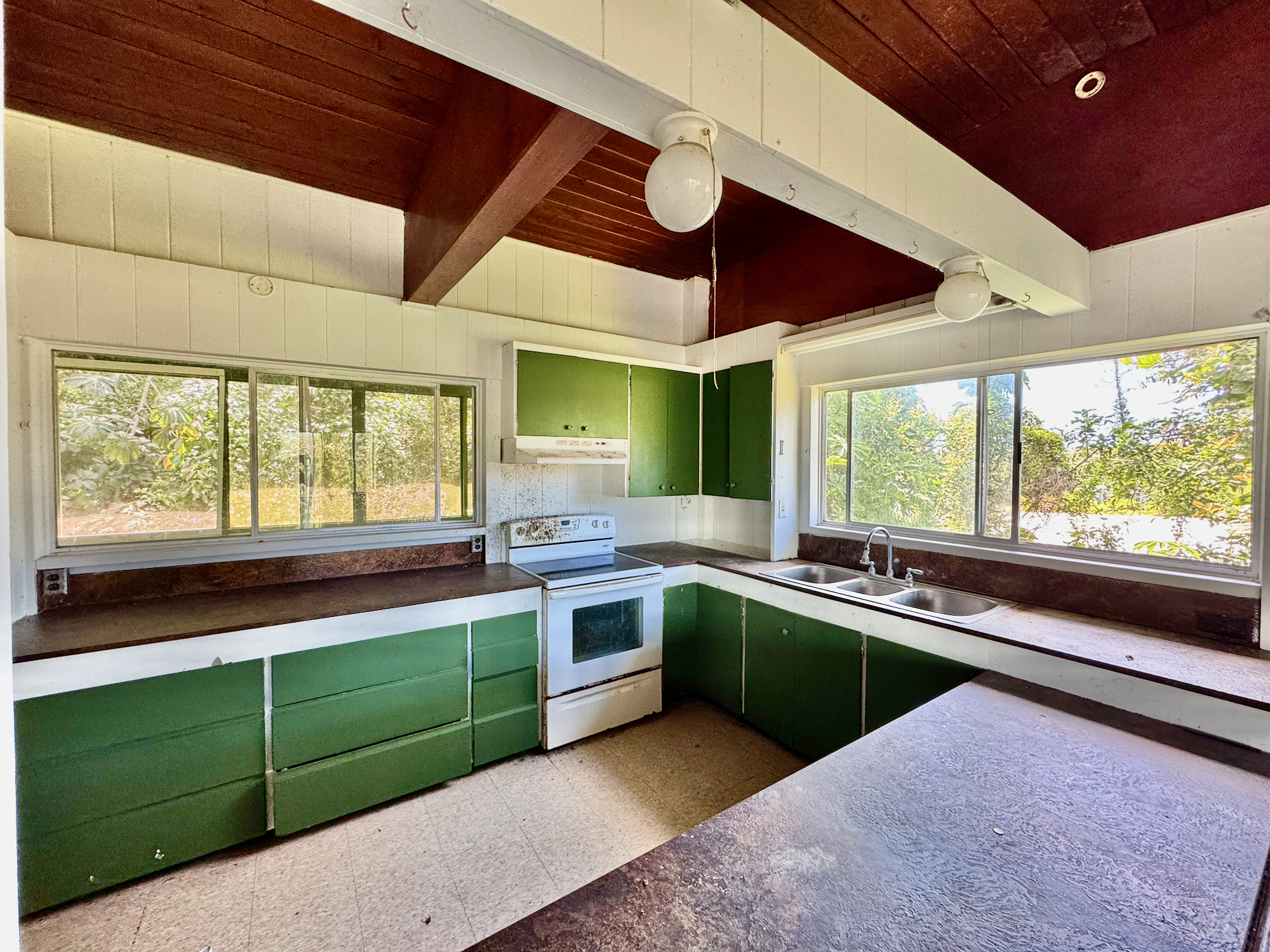 Kitchen window on left looks out into the breezeway.