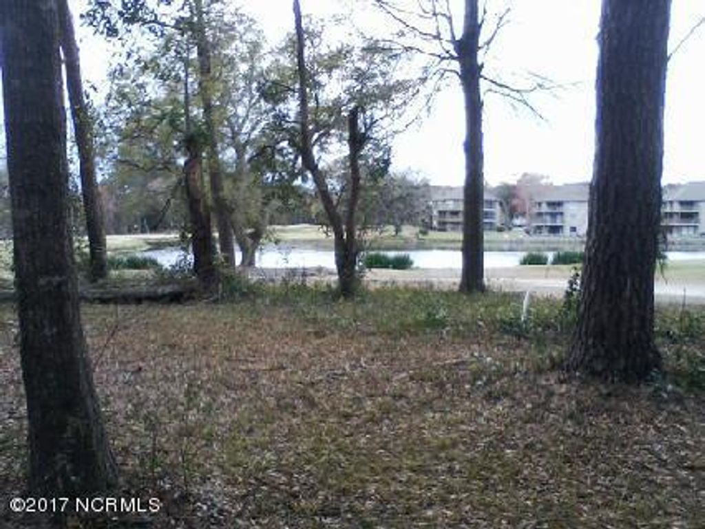 Photo of 7 Lakeshore Drive, Sunset Beach, NC 28468 (MLS # 100053006)