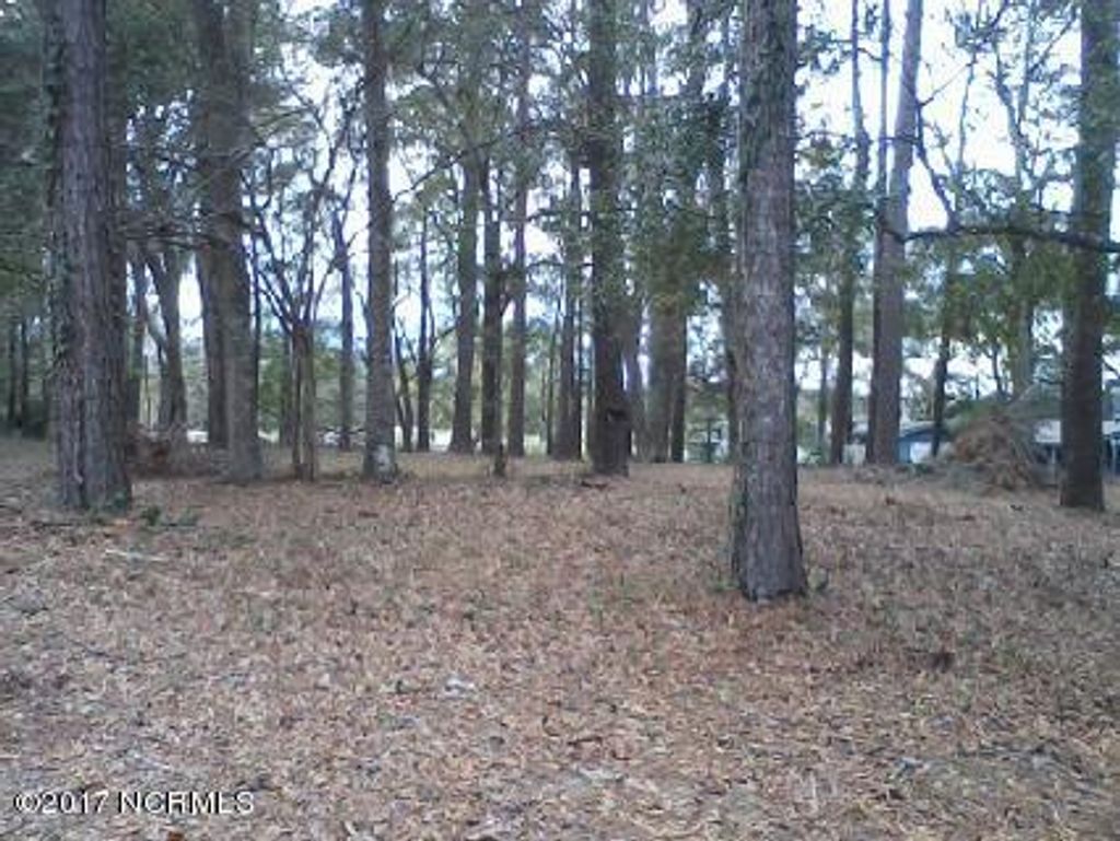 Photo of 7 Lakeshore Drive, Sunset Beach, NC 28468 (MLS # 100053006)