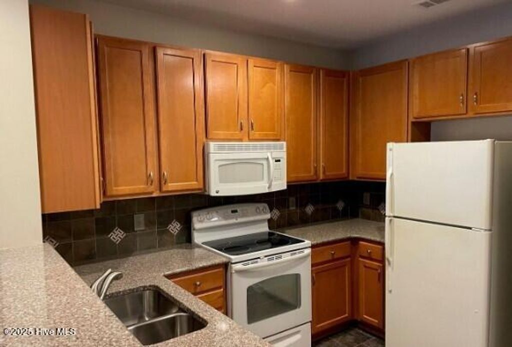 Photo of 618 Condo Club Drive #Unit 311, Wilmington, NC 28412 (MLS # 100522582)