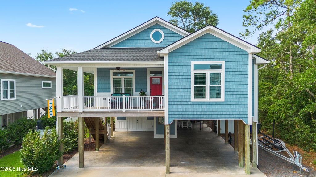 Photo of 305 E Yacht Drive, Oak Island, NC 28465 (MLS # 100538939)