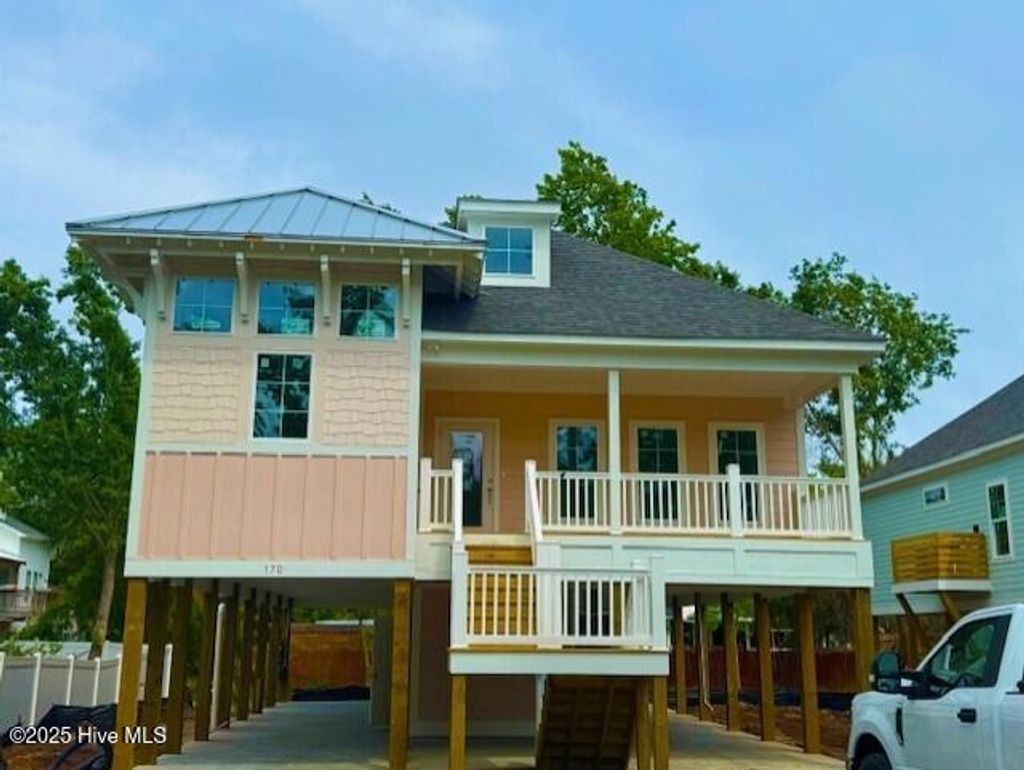 Photo of 170 NE 31st Street, Oak Island, NC 28465 (MLS # 100502885)